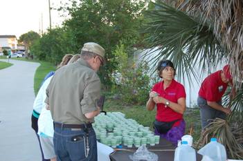 Volunteers served water at the 2015 May Day 10K race.