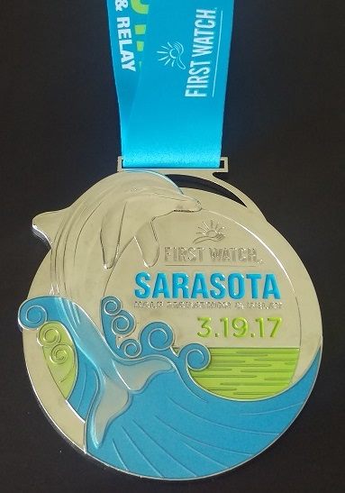 Finisher Medal for 2017 First Watch Sarasota Half Marathon.