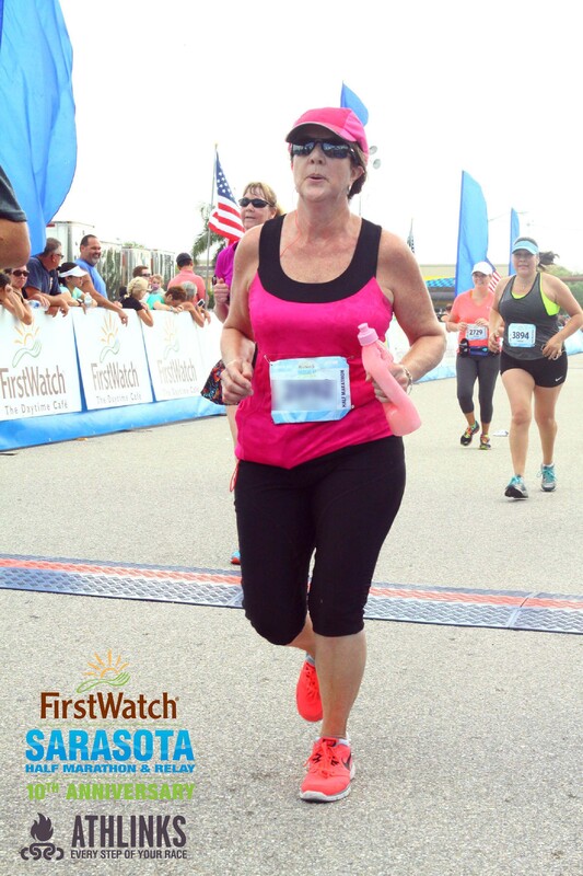 Crossing the finish line at the First Watch Sarasota Half Marathon.
