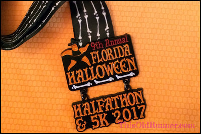 2017 medal from Florida Halloween Halfathon & 5K at Fort DeSoto Park.