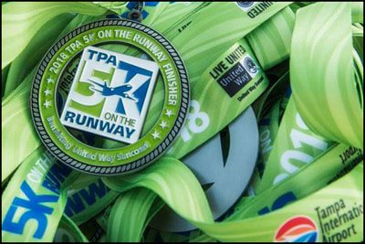 2018 medal for the Tampa International Airport 5K on the Runway to benefit the United Way.