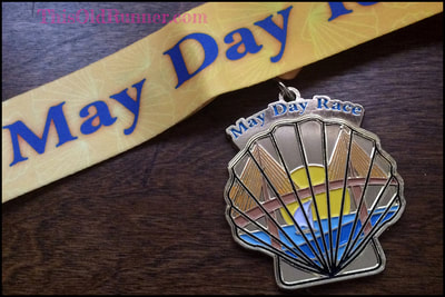 2018 medal for the May Day 10K at Ceridian in St. Pete, FL