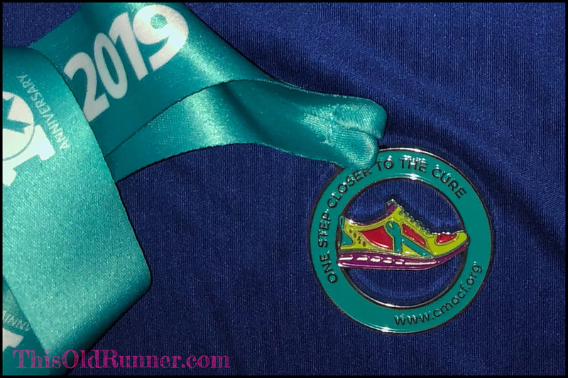 Finisher medal from 2019 One Step Closer to the Cure 10K race in St. Pete, Florida.