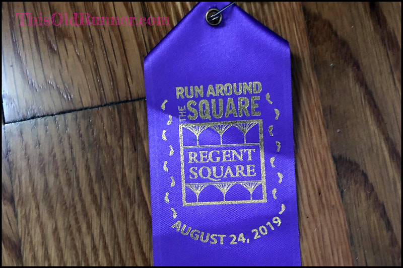 Purple finisher ribbon from Run Around the Square 5K in Pittsburgh.