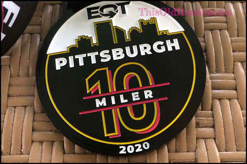 Medal for the 2020 VIRTUAL EQT Pittsburgh 10 Miler features the city skyline.