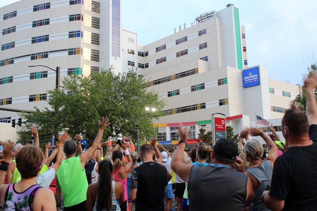 Runners wave to the Children inside JH All Children's Hospital in St. Petersburg, FL.