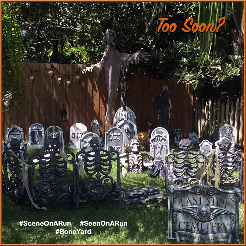 Spooky Halloween graveyard decoration. Lots of headstones and skeletons.