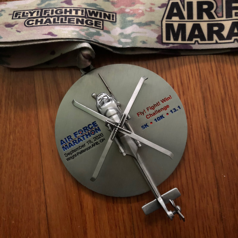 Special Fly! Fight! Win! Challenge finishers medal has a HH-60G Pave Hawk helicopter with moving propellers.