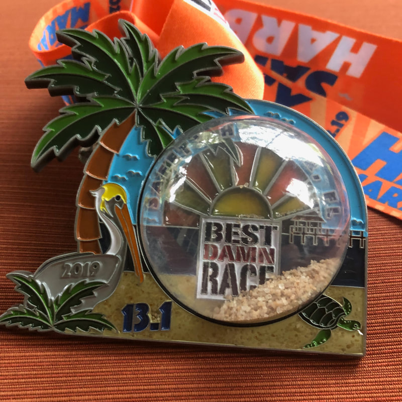 2019 medals from the Best Damn Race half marathon.