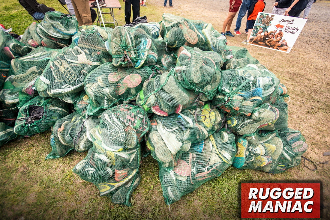 Pile of donated shoes at Rugged Maniac race.