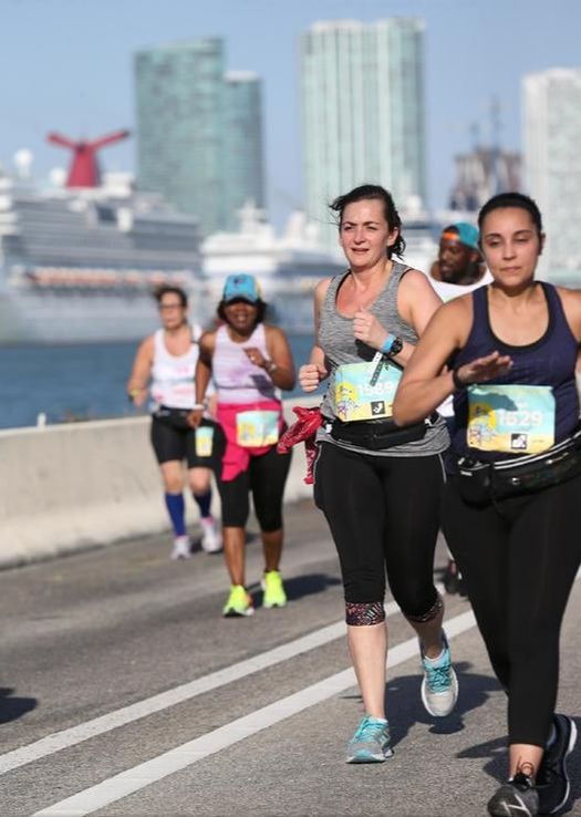 Runners cross MacArthur Causeway in Miami.