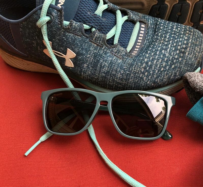 Knockaround sunglasses and running shoe.