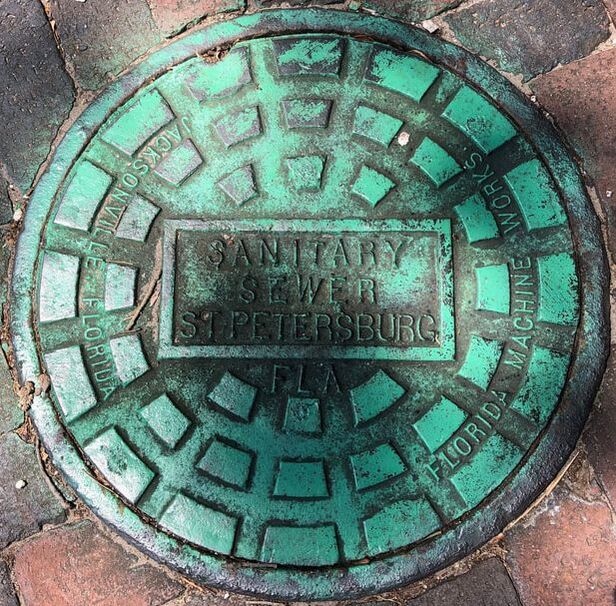 Sanitary Sewer cover in an alley in St. Petersburg, Florida