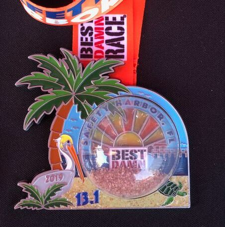 Front view of sand globe race medal Best Damn Race
