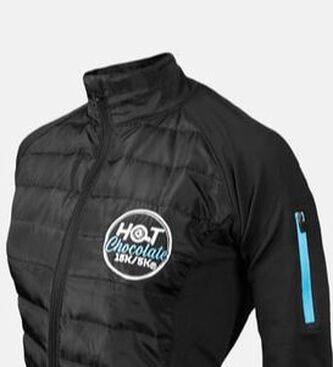 Hot Chocolate 15K/5K race jacket features race logo and puffer jacket style on front.