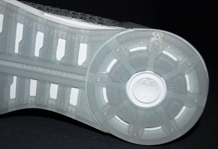 Closeup of bottom of UA HOVR Sonic running shoes.
