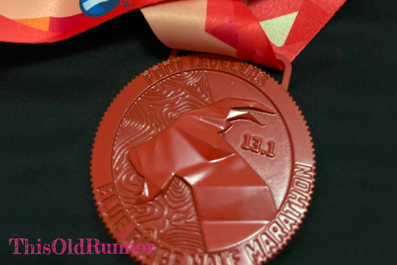 Finisher medal for the 2022 Blue Ridge Half Marathon.