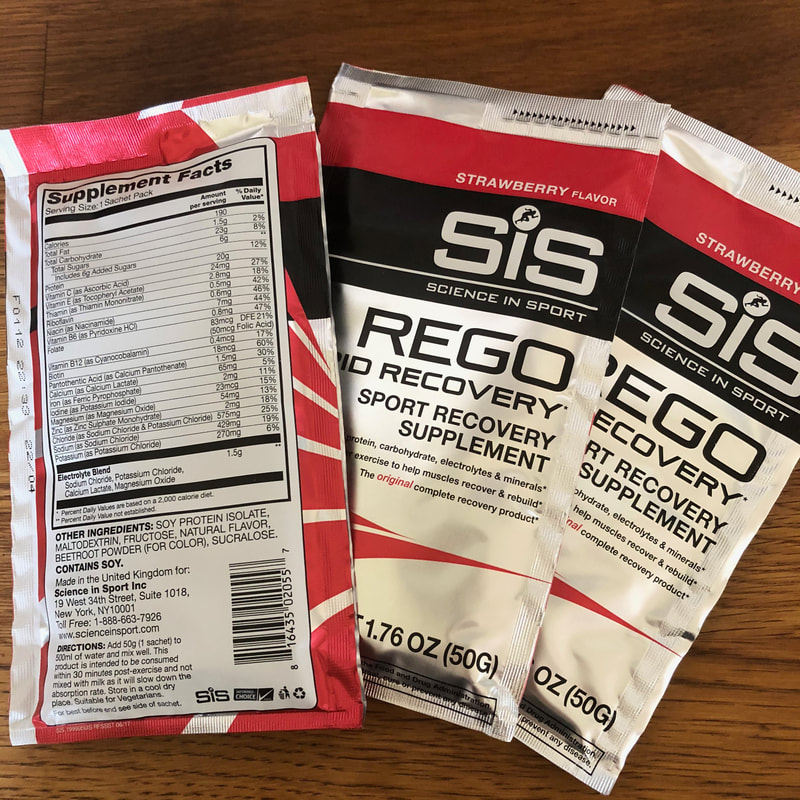 Strawberry packets of SiS REGO Rapid Recovery Powder.