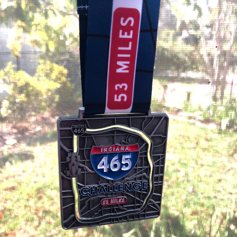 The inaugural 465 Challenge medal has an Indy race car that moves around the medal.