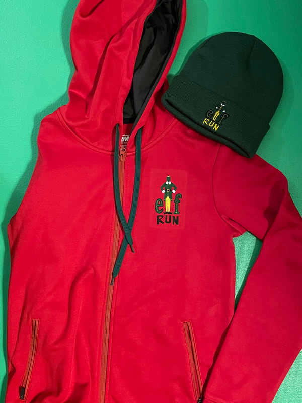 Elf Virtual Run SWAG includes green beanie and red hoodie with the ELF movie logo.