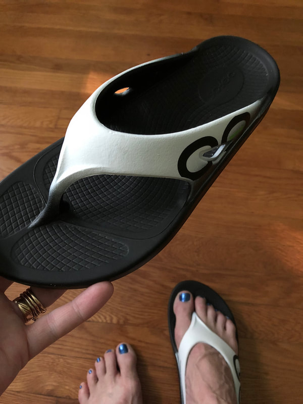 View of Oofos White Cloud sport sandals.
