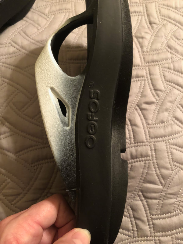 Side view of Oofos cushioned arch support.