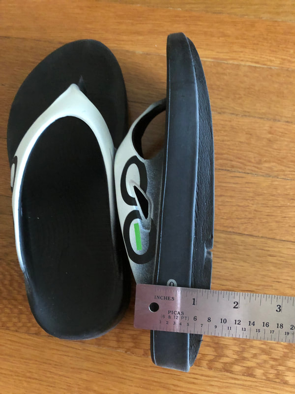 Thick sole on Oofos sandals.