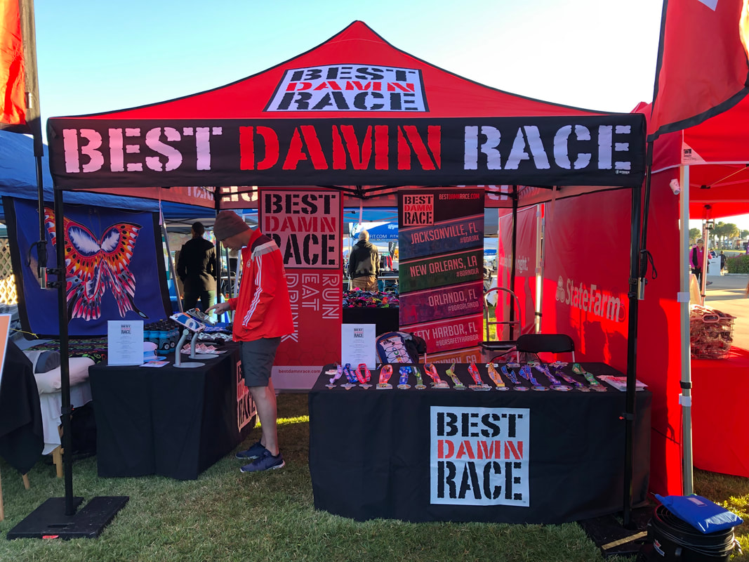 Best Damn Race Booth at the St Pete Run Fest Expo on November 17, 2018