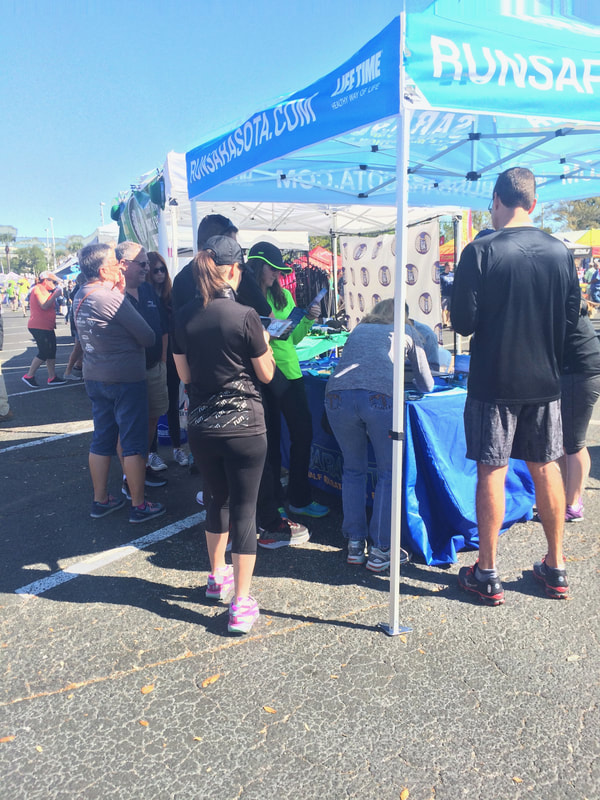 People register for Sarasota Half Marathon at the Skyway10K expo.