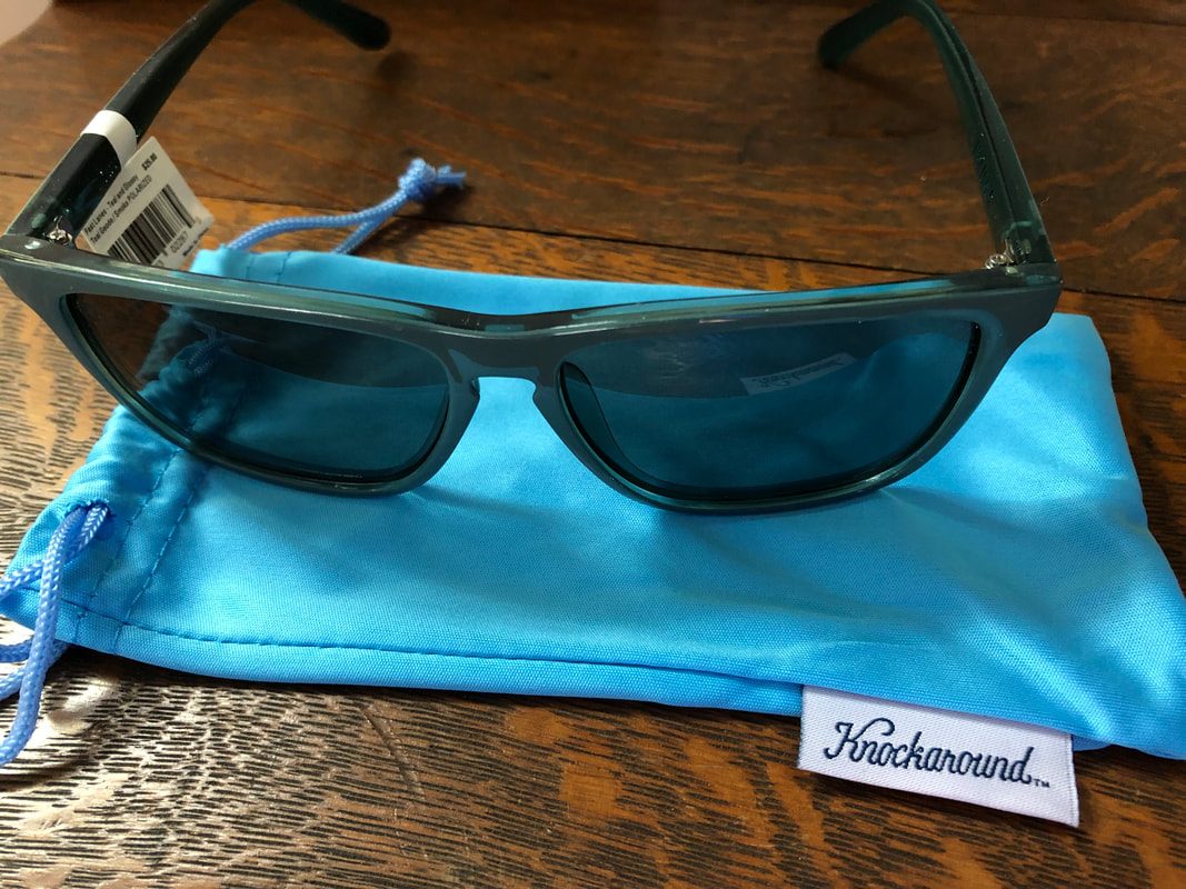Knockaround Fast Lanes sunglasses with the protective cover.