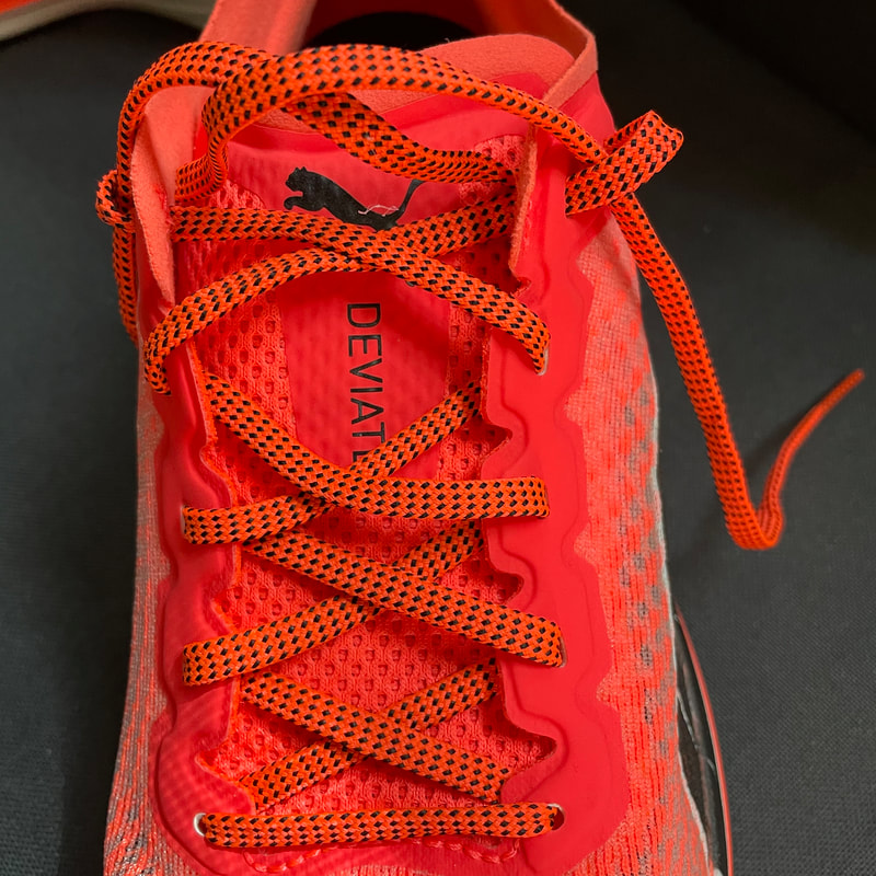 Closeup of laces on Puma Deviate Nitro running shoes.