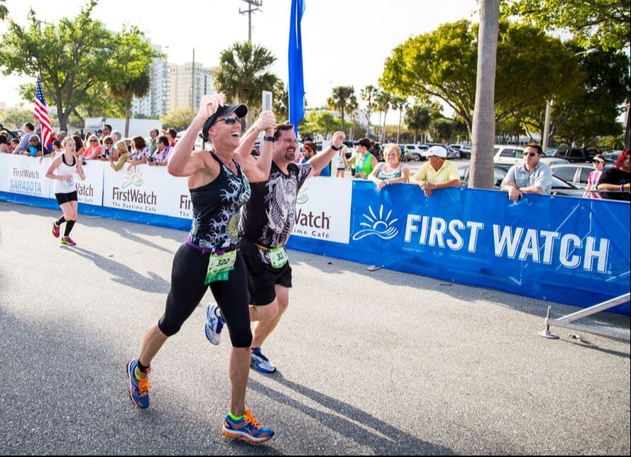 Relay team finishes together at the First Watch Sarasota Half Marathon.