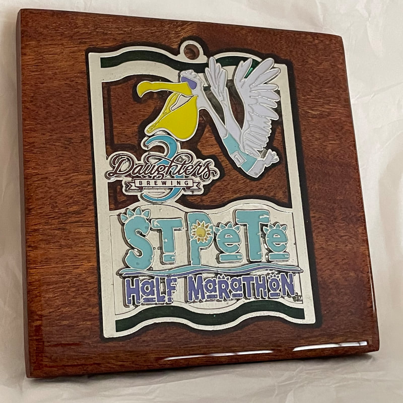 St Pete Run Fest medal transformed into a custom wooden coaster.